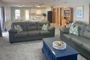 a living room with a couch and a table at Island Charm in St. George Island