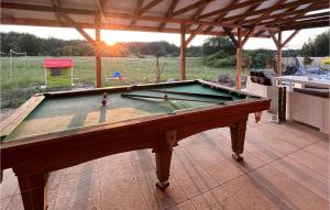 a pool table sitting on top of a patio at Nice Home In Stare Sady With Kitchen in Stare Sady