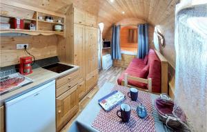 a small kitchen and living room in a tiny house at Stunning stacaravan In Pouilly-sous-charlieu With Kitchen in Pouilly-sous-Charlieu