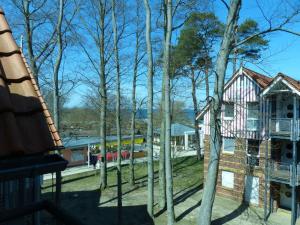 a train station with a train on the tracks at Seeblick Wohnung 113 mit teilw Meerblick in Ostseebad Koserow