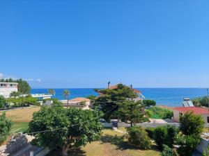 a view of the ocean from a building at Drosia Apartments in Kypseli