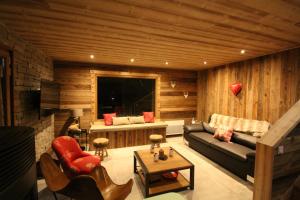 a living room with a couch and a table at 3 Biches in Font-Romeu-Odeillo-Via