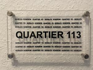 a sign that reads quarter on a wall at Seeblick Wohnung 113 mit teilw Meerblick in Ostseebad Koserow