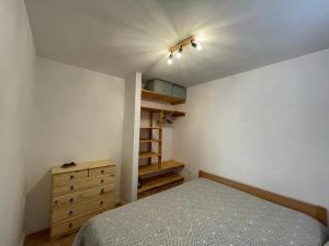 a bedroom with a bed and a ceiling fan at Apartments Netty in Dramalj