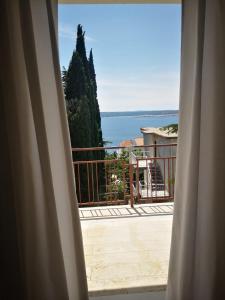 a view of the ocean from a window at Apartments Netty in Dramalj