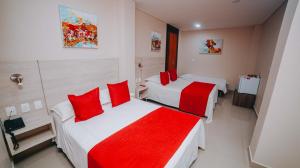 Ένα ή περισσότερα κρεβάτια σε δωμάτιο στο Hotel Seven Monteria