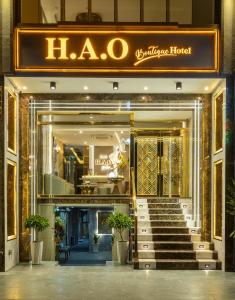 a store front of a luxury hotel with a staircase at Hao Boutique Hotel in Ho Chi Minh City