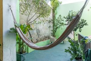 a hammock in a room with plants at The Spanglish Rooftop Garden Modern Historical in Dearing