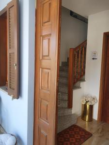 a door leading up to a staircase with a stair case at CASA REGINA in Crevoladossola