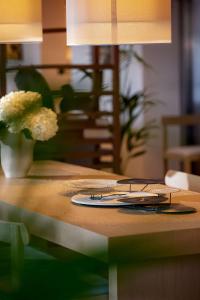 a table with a pair of glasses on top of it at Angsana Corfu Resort & Spa in Benitses
