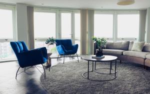 a living room with a couch and chairs and a table at Luxury Three-Bedroom Penthouse- By Resify in Nottingham