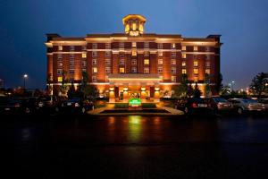 a large building with a clock tower on top of it at Courtyard Columbus Easton in Columbus