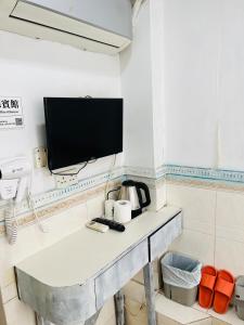 TV a/nebo společenská místnost v ubytování 嘉應賓館HAKKAS GUEST House