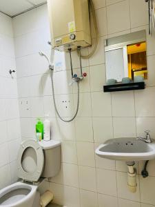 Koupelna v ubytování 嘉應賓館HAKKAS GUEST House