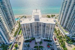 an aerial view of a building next to the ocean at Beach Paradise a cozy ocean view condo on the beach with free parking in Hollywood