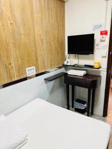 TV a/nebo společenská místnost v ubytování 嘉應賓館HAKKAS GUEST House