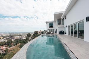 a swimming pool in the backyard of a house at Stunning View Hollywood Hills Guest House in Los Angeles