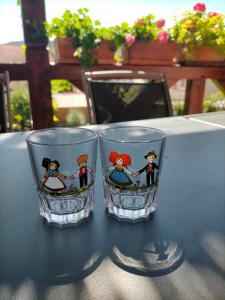 two glasses sitting on top of a table at Chez Yolande in Nothalten