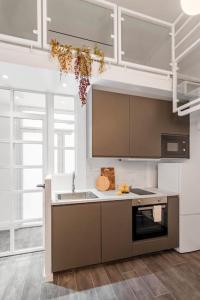 a kitchen with a sink and a stove top oven at Beautiful and cosy flat La Latina-Rastro-IZQ in Madrid