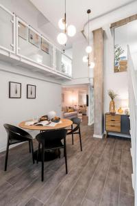 a dining room and living room with a table and chairs at Beautiful and cosy flat La Latina-Rastro-IZQ in Madrid