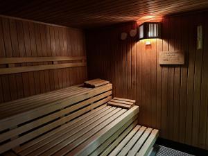 a sauna with a light and a sign in it at Appartementhaus Birkenwald in Seefeld in Tirol