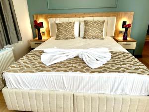 a bedroom with a large bed with white sheets and pillows at Newalla Hotel Old City in Istanbul +106 photos