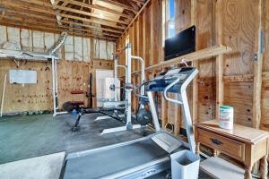 a gym with a treadmill and a flat screen tv at Adorable 1 BDR with Full Kitchen Deck Washer Dryer in Panama City