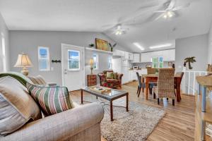 a living room with a couch and a table at Adorable 1 BDR with Full Kitchen Deck Washer Dryer in Panama City