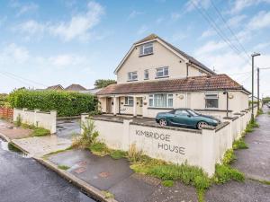 a house with a sign that reads mortgage house at Pass the Keys Stylish Flat Close To Beach in Chichester