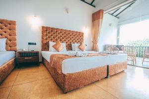 Letto o letti in una camera di Samudra Beach Resort