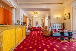 a hotel lobby with a red carpet at Muthu Alexandra Hotel in Oban