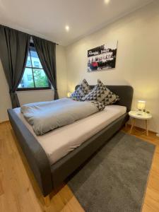 a bed with pillows on it in a bedroom at Moderne Ferienwohnungen in Dissen in Dissen