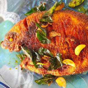 a close up of a piece of food on a plate at Achayans Homestay Mararikulam in Mararikulam