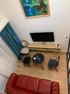 TV a/nebo společenská místnost v ubytování Illyrian Boutique Hotel