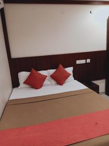 Voodi või voodid majutusasutuse Hotel Neem Tree Hyderabad Airport toas