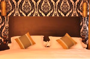 Postel nebo postele na pokoji v ubytování Palais Riad Reda & Spa