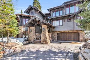 a large wooden house with a garage at West Red Pine Oasis in Park City