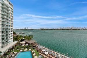a view of the water from a building at 1100 West South Beach Luxe Miami Condos by Joe Semary in Miami Beach