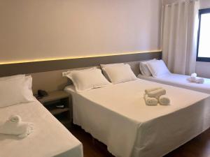 Safa Hotel Foz客房内的一张或多张床位