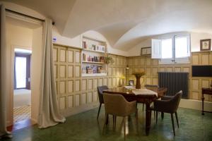 a dining room with a table and chairs at Bell Plançó B&B in Moià