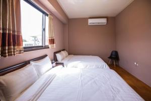 Vuode tai vuoteita majoituspaikassa Woolywo B&B 花蓮縣民宿第2451號
