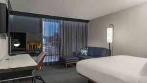 a hotel room with a bed and a desk at Courtyard by Marriott San Diego Miramar in San Diego
