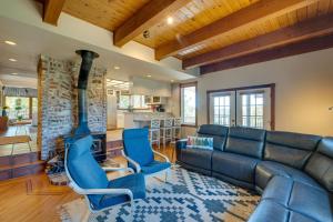 a living room with a couch and a fireplace at Meadow Vista Mountain Escape with River Views! 