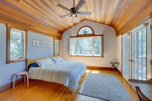 a bedroom with a bed and a ceiling fan at Meadow Vista Mountain Escape with River Views! 