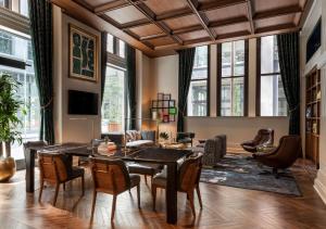 a living room with a table and chairs at Canopy By Hilton Philadelphia Center City in Philadelphia