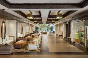 a lobby of a store with chairs and tables at Cape Rey Carlsbad Beach, A Hilton Resort & Spa in Carlsbad