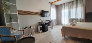 TV a/nebo společenská místnost v ubytování Bed & Bike Feltre
