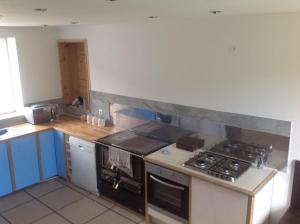 a kitchen with a stove and a counter top at Freval in Clairefougère