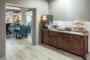 a kitchen with a counter with some bread on it at Hampton Inn Austin NW near The Domain in Austin
