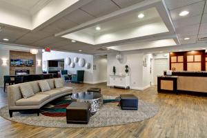a living room with a couch and a table at Homewood Suites by Hilton Newark-Cranford in Cranford